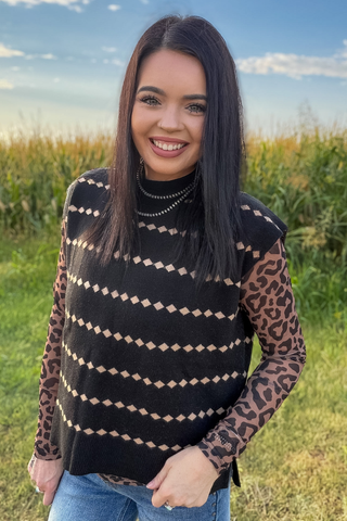 Sterling Kreek Women’s Black Canyon Sweater Vest layered over leopard print top