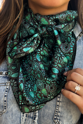 Close-up of Sterling Kreek Cowgirl Cluster wild rag with turquoise, teal and green Western print