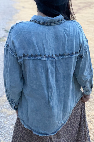 Back view of Sterling Kreek women’s washed denim shacket with raw-edge yoke detail