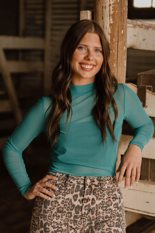 Sterling Kreek women’s Meshed Out turquoise sheer long sleeve top