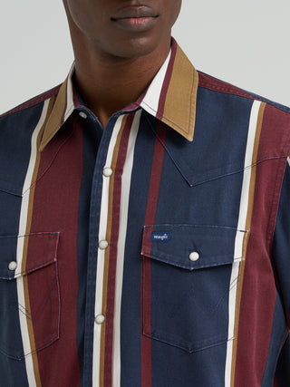 Wrangler men’s Retro Brushpopper long sleeve snap shirt featuring navy, burgundy, gold and cream vertical stripes, pearl snaps, Western yokes, and dual chest pockets.