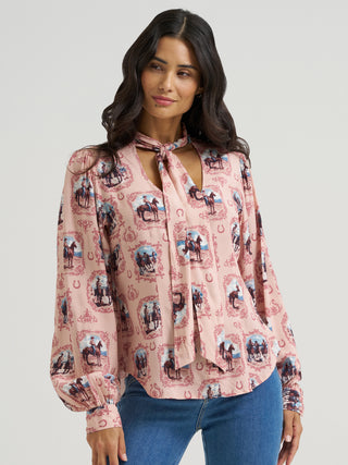 Wrangler women’s pink Western blouse featuring vintage cowgirl cameo print and self-tie neck bow