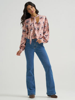 Wrangler women’s pink Western blouse featuring vintage cowgirl cameo print and self-tie neck bow