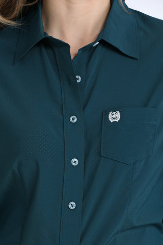 Cinch women’s teal ArenaFlex performance western shirt with breathable mesh fabric, long sleeves, chest pocket, and stretch comfort.