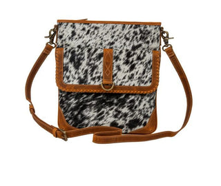 Front view of Myra Taragon Hair-On Hide Bag with caramel leather and cowhide panel”