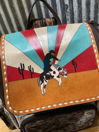 Custom Western Cowboy Sunrise Backpack – Hand - Painted Leather Flap with Hair - On Hide and Tooled Straps - Cowboy SwaggerCustom Western Cowboy Sunrise Backpack – Hand - Painted Leather Flap with Hair - On Hide and Tooled Straps