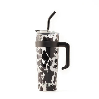 Myra Wide Wyoming Cow Print Travel Tumbler – Western insulated stainless steel cup with black-and-white cowhide print and secure lid.