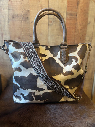 Nocona Jessi Ray Conceal Carry Large braided Cow Print Tote Bage with Bandana Strap - Cowboy SwaggerNocona Jessi Ray Conceal Carry Large braided Cow Print Tote Bage with Bandana Strap