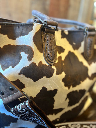 Nocona Jessi Ray Conceal Carry Large braided Cow Print Tote Bage with Bandana Strap - Cowboy SwaggerNocona Jessi Ray Conceal Carry Large braided Cow Print Tote Bage with Bandana Strap