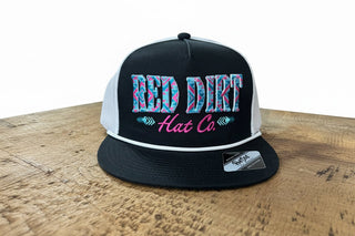 Red Dirt Hat Co Pink & Blue Aztec Logo Embroidered Trucker Cap – Black & White Mesh Snapback - Cowboy SwaggerRed Dirt Hat Co Pink & Blue Aztec Logo Embroidered Trucker Cap – Black & White Mesh Snapback