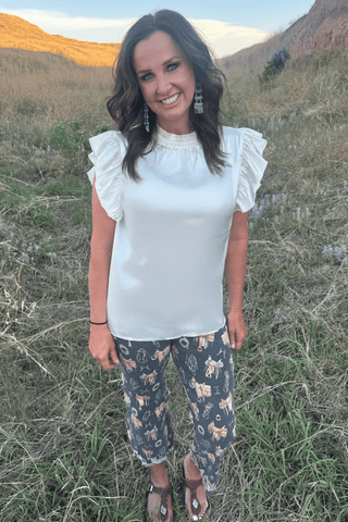 Sterling Kreek Women’s Cream Babydoll Flutter Sleeve Western Top - Cowboy SwaggerSterling Kreek Women’s Cream Babydoll Flutter Sleeve Western TopShirts & Tops