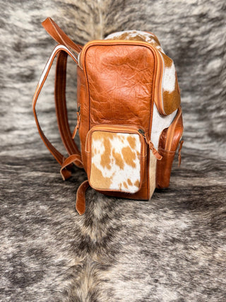 Western Pink and Turquoise Free Bird Tooled Cowhide Backpack – White and Tan Leather Hide Bag - Cowboy SwaggerWestern Pink and Turquoise Free Bird Tooled Cowhide Backpack – White and Tan Leather Hide Bag